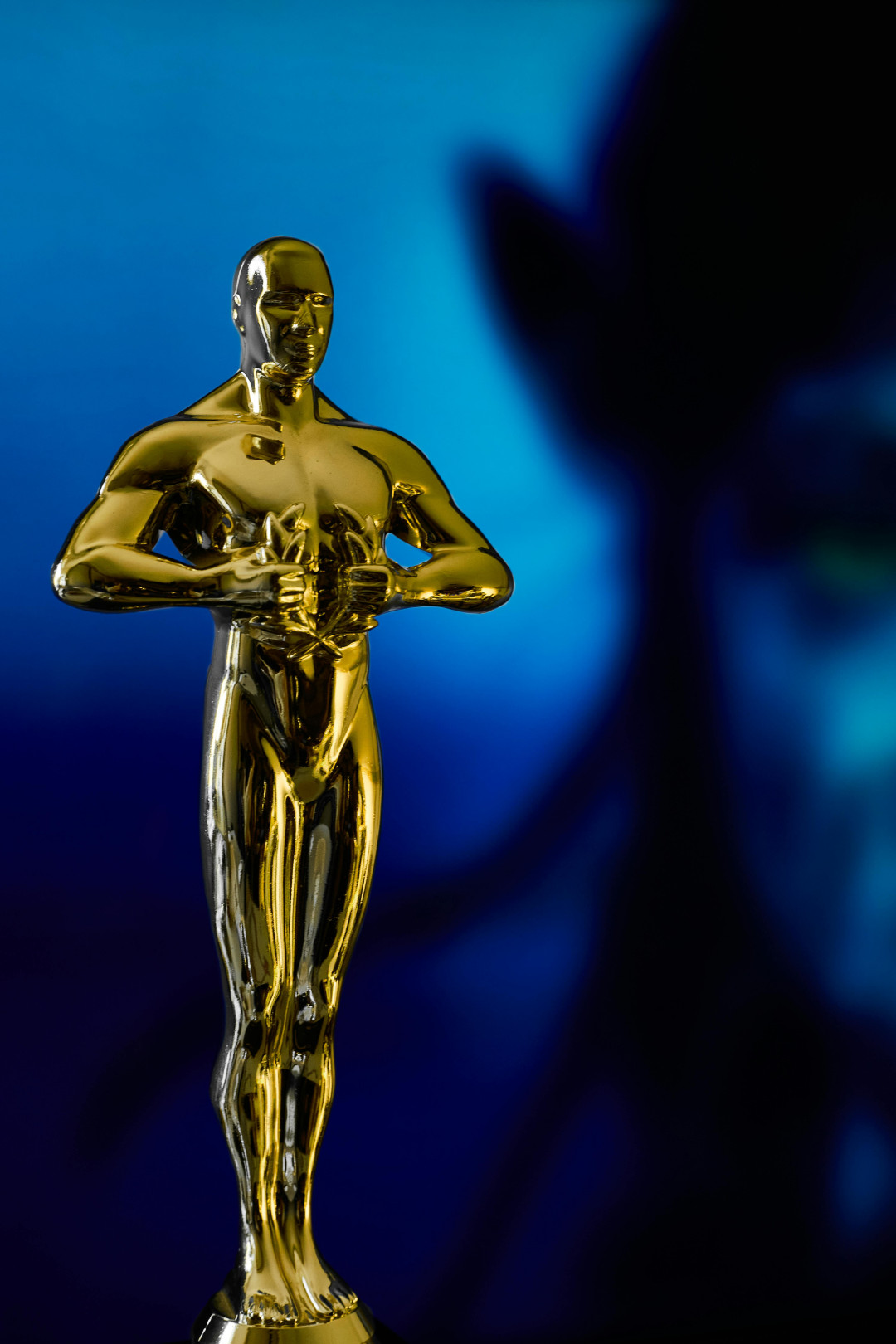 oscar-statue-bronze-award-against-black-background-image