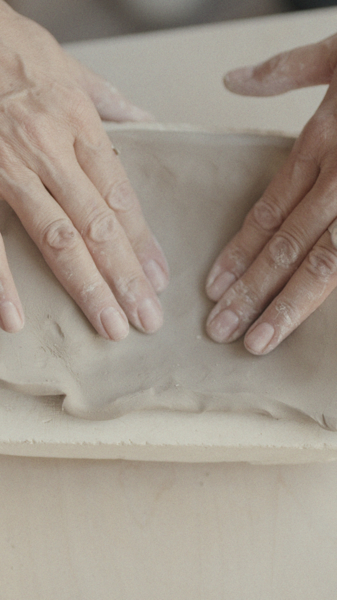 artist-hands-making-ceramic-plate-image