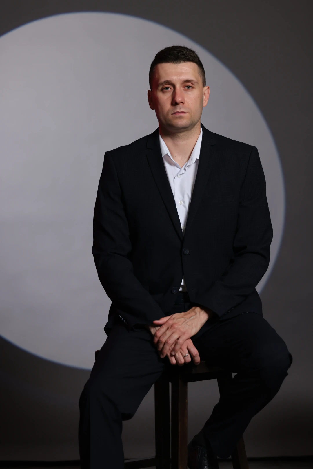 sergey-timofeev-sitting-in-suit-image