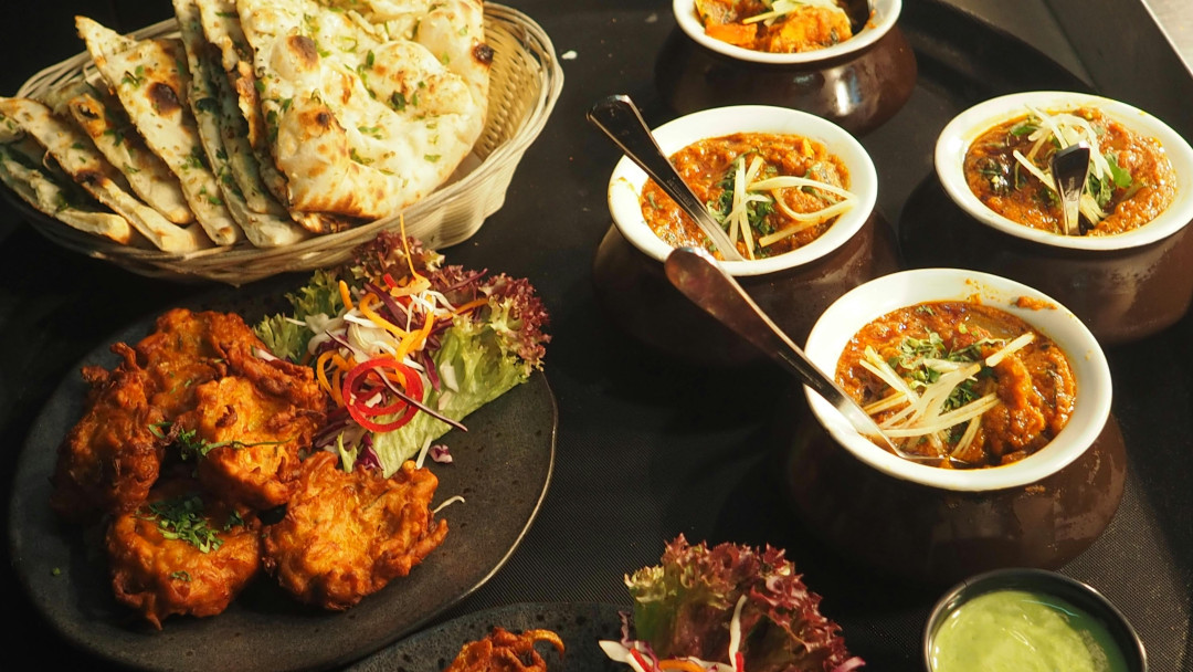 table-with-variety-of-indian-dishes-image
