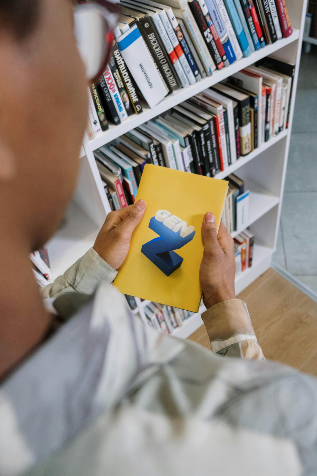 young-man-holding-book-generation-z