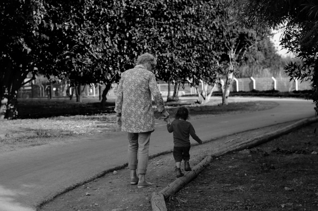 grandmother-and-grandson-walking-together-outdoors-image