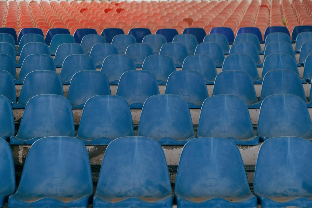 empty-blue-and-red-plastic-stadium-seats