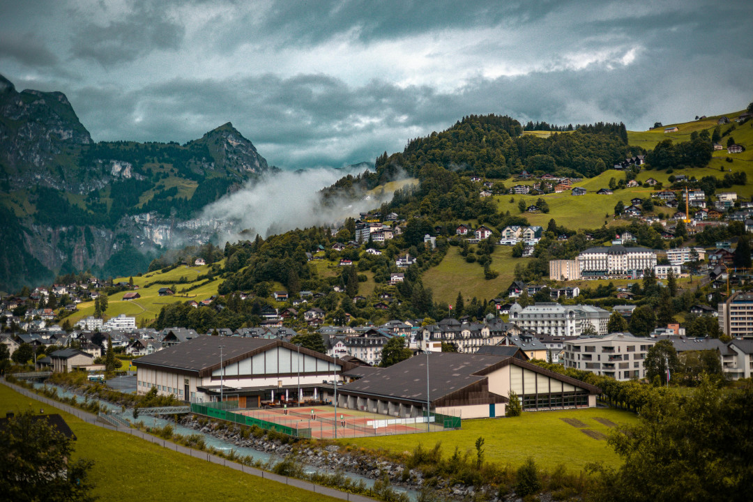 swiss-mountain-village-landscape-lush-greenery-scenery-image