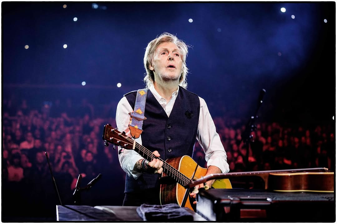 paul-mccartney-with-guitar-on-stage-image
