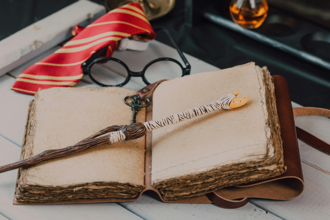 harry-potter-book-series-and-glasses-on-wooden-table-image