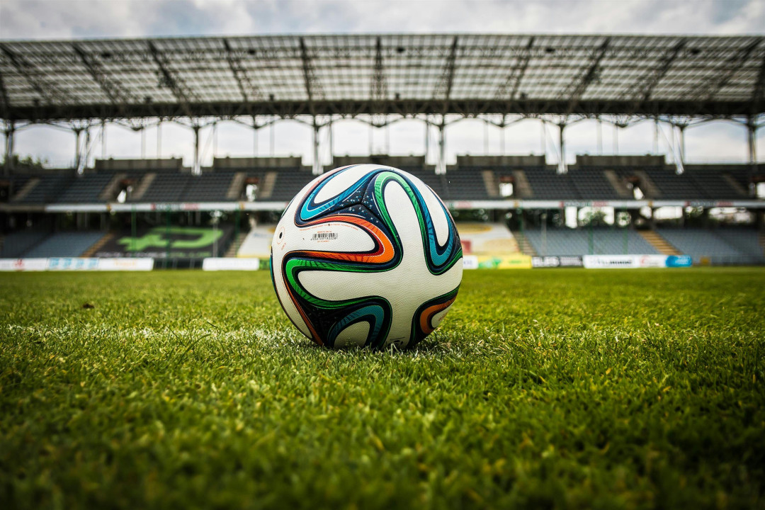 colorful-soccer-ball-on-green-field-image