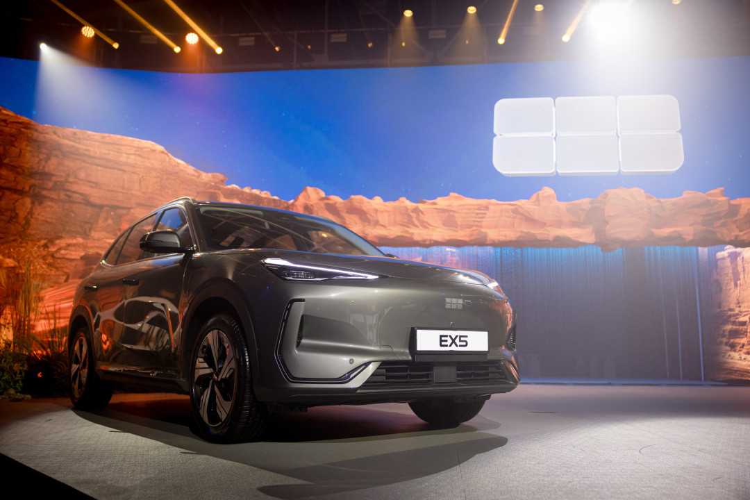 sleek-electric-suv-ex5-on-stage-during-auto-presentation-image
