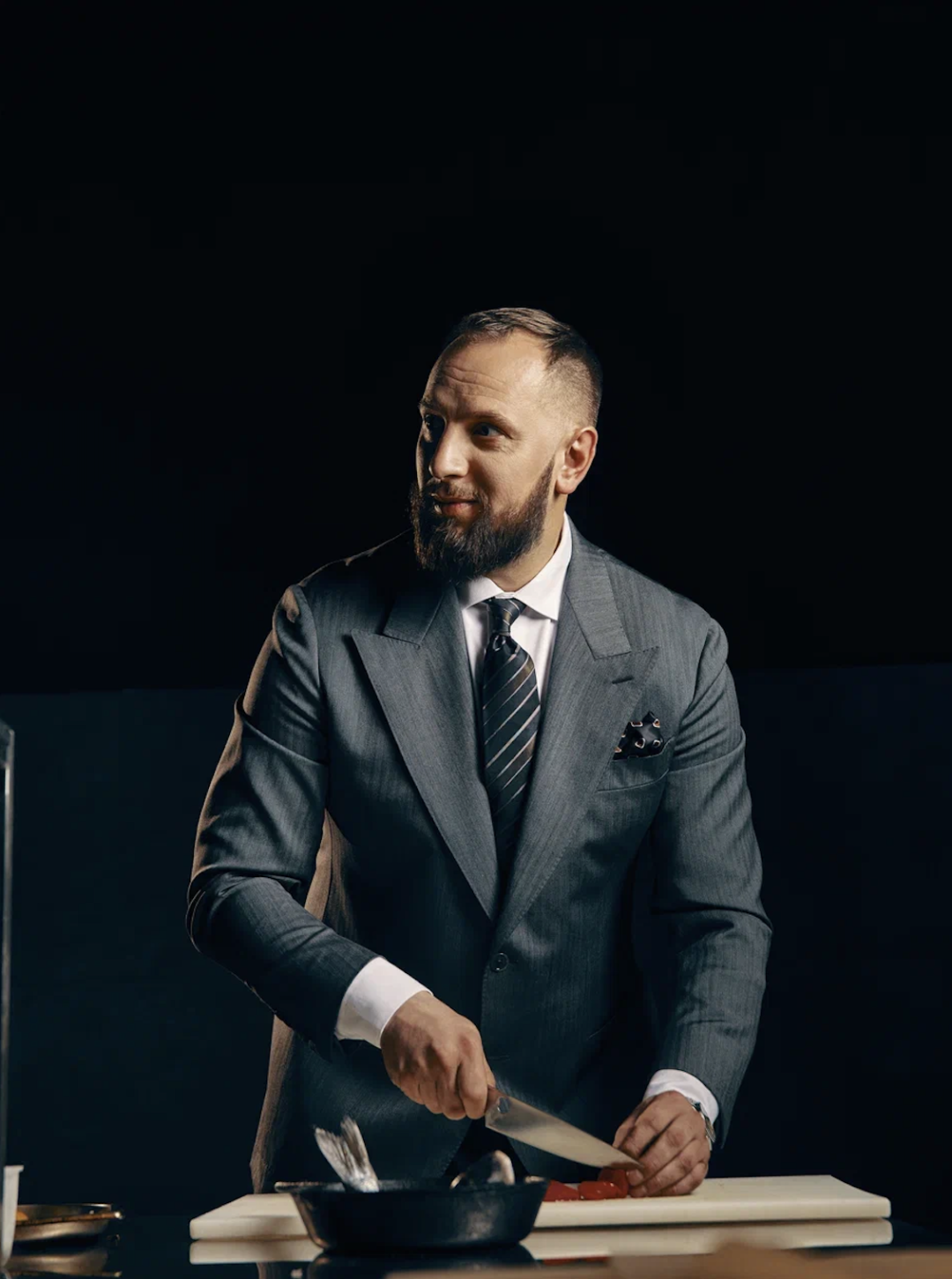 alexander-telesh-cutting-fish-in-classic-suit-astana-image